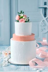 Picture of Raw white wedding cake with orange floor