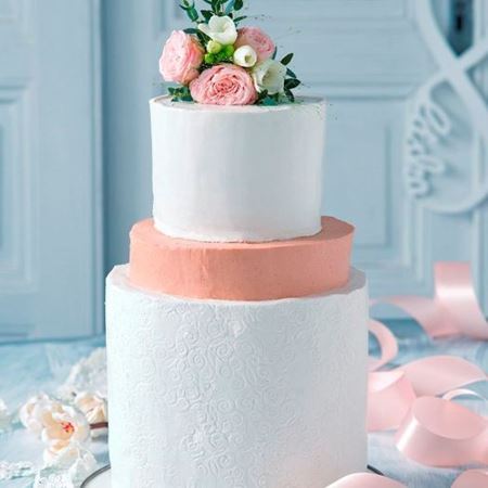 Picture of Raw white wedding cake with orange floor